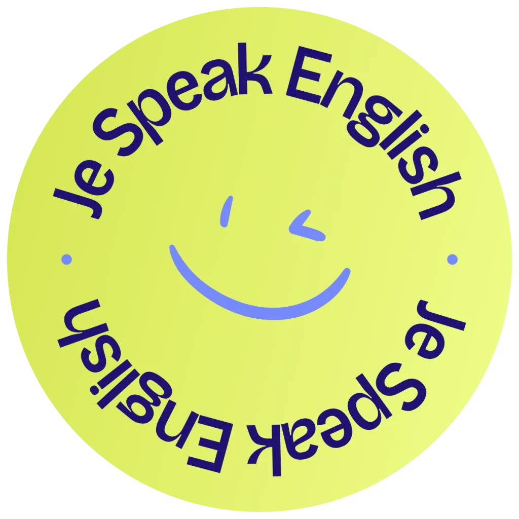 Badge rond jaune/vert Je Speak English avec un smiley au centre et le texte "Je Speak English" en demi-cercle autour